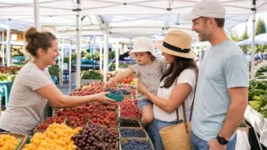 Family choosing fresh berries at an outdoor Calgary farmers market