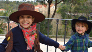 Kids in cowboy hats enjoying the Calgary Stampede festival