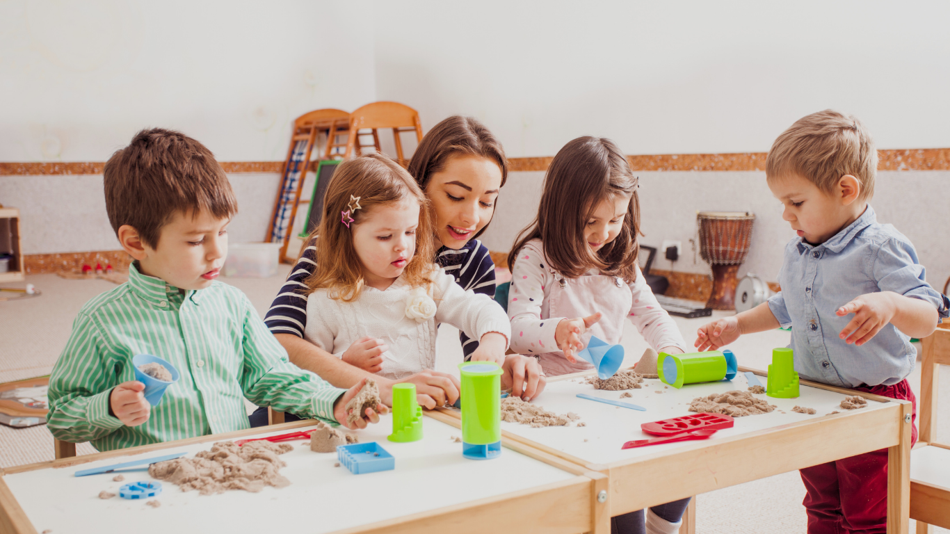 Children enthusiastically playing with toys in a colorful classroom, showcasing the interactive nature of early childhood education.