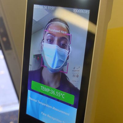 Illustrative images to show the procedure for gaining access to 
Clever Day Care - including scanning the QR code to take the online Covid-19 test, having forehead scanned for temperature reading then santizing hands before continuing on.