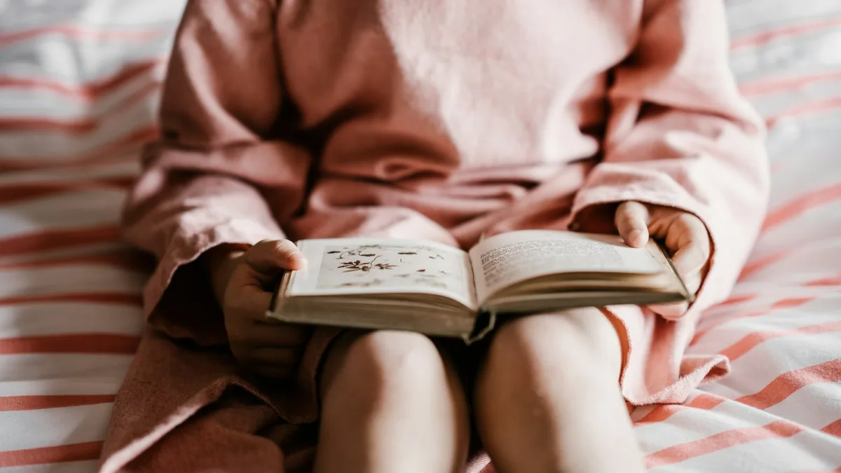 Child enjoying a book during read-aloud time